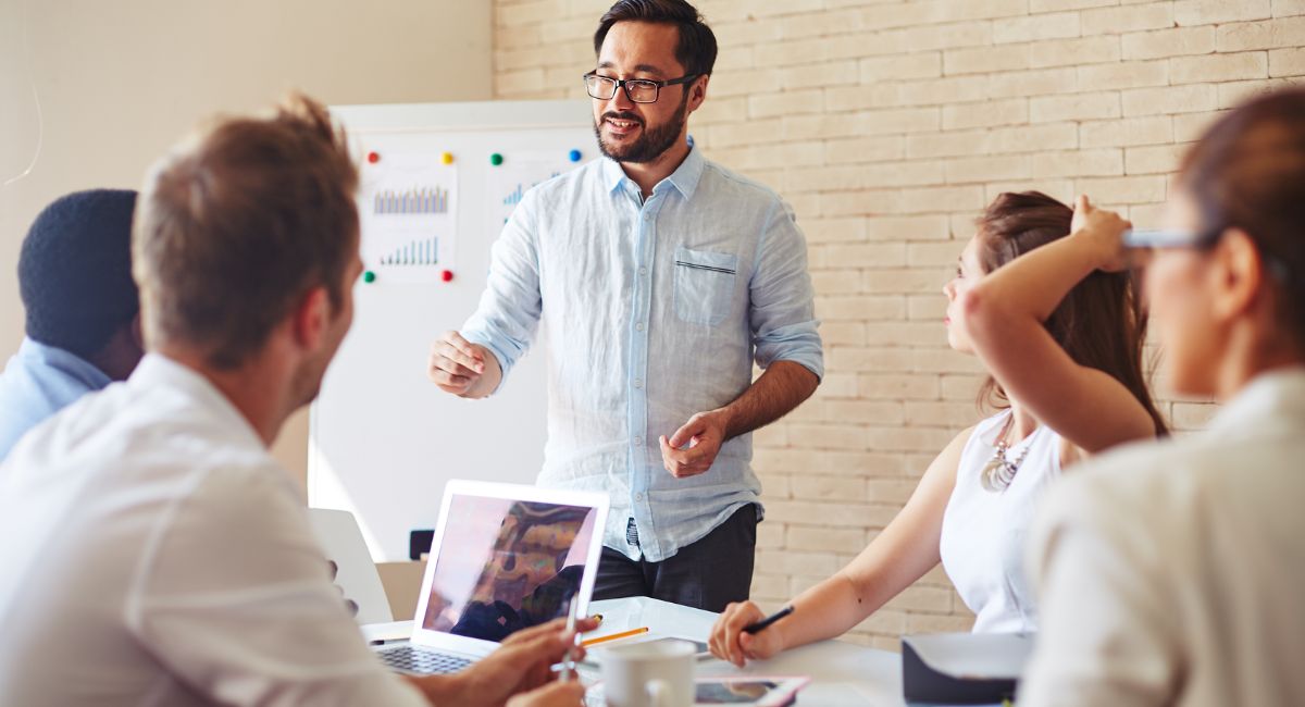 Team meeting discussing medical billing solutions and performance results